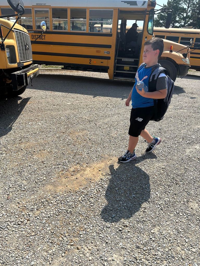 Mills Excavating donated water bottles for district bus riders.